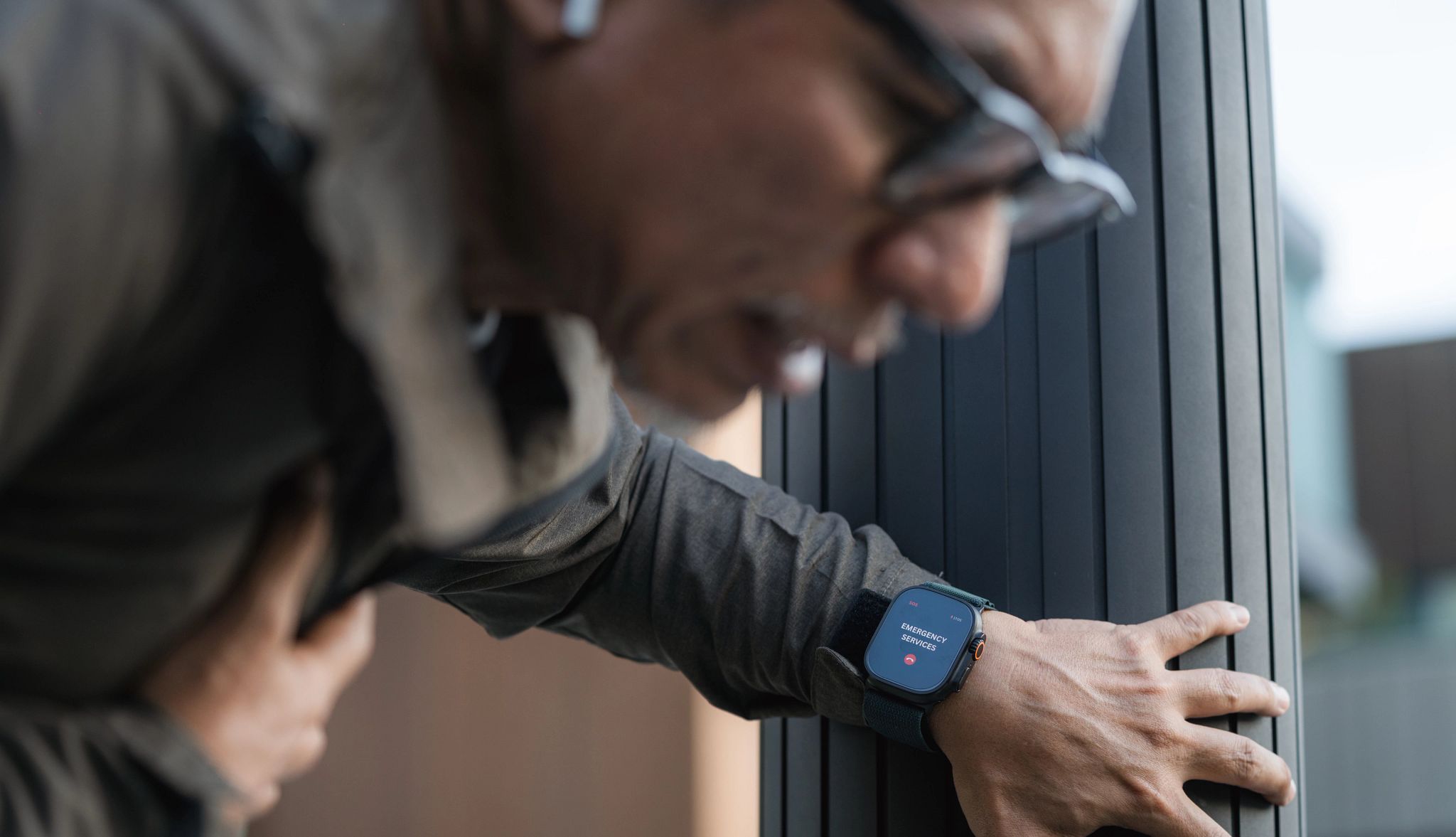 AARP Smart Guide to Wearable Technology a person clutching their chest while having a health issue