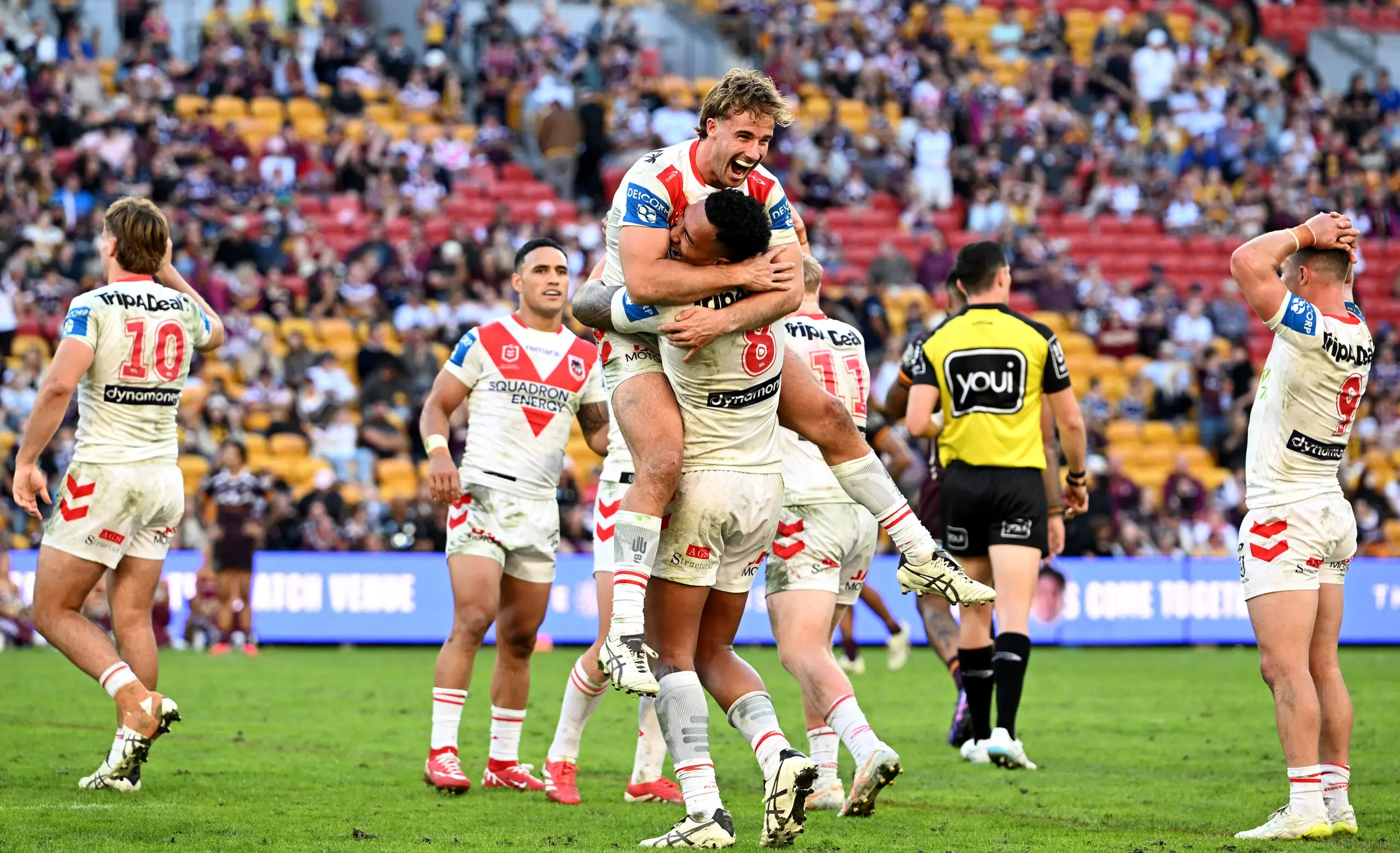 BRISBANE, AUSTRALIA - MAY 31: Ryan Couchman and Loko Jnr Pasifiki Tonga of the Dragons and team mates celebrate victory after the round 13 NRL match between Brisbane Broncos and St George Illawarra Dragons at Suncorp Stadium, on May 31, 2026, in Brisbane, Australia. (Photo by Bradley Kanaris/Getty Images)