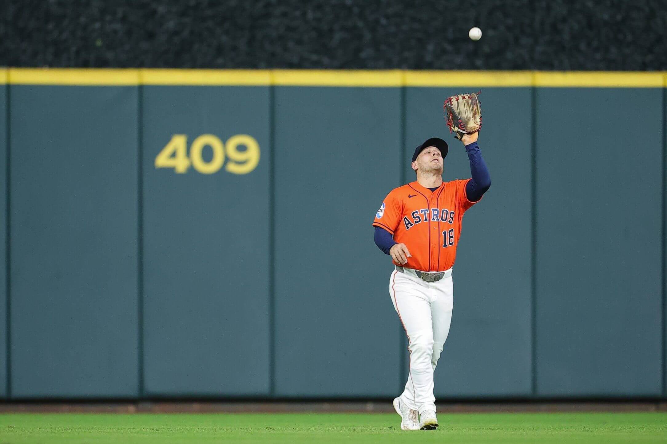 Daulton Varsho #18 of the Houston Astros makes a catch on a fly ball during the fourth inning against the Seattle Mariners at Daikin Park on August 14, 2026 in Houston, Texas.