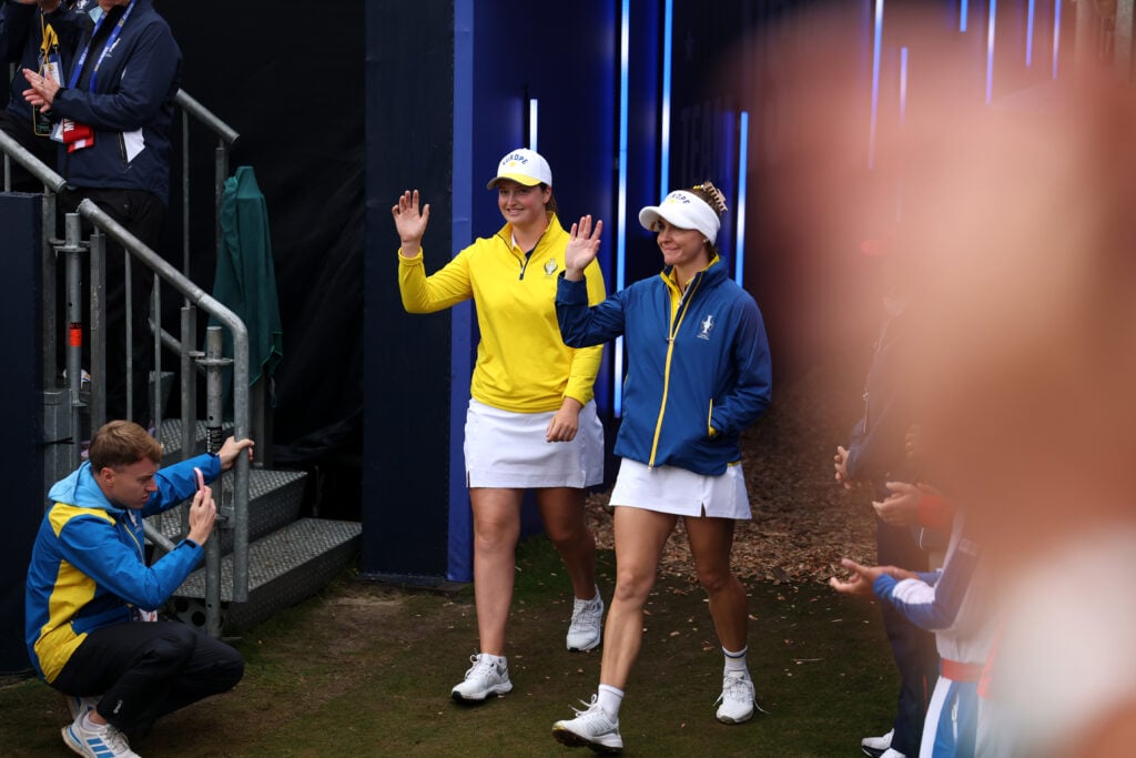 Charley Hull and Lottie Woad on walk down the fairway during the Friday afternoon four-balls matches of the Solheim Cup 2026 at Bernardus Golf