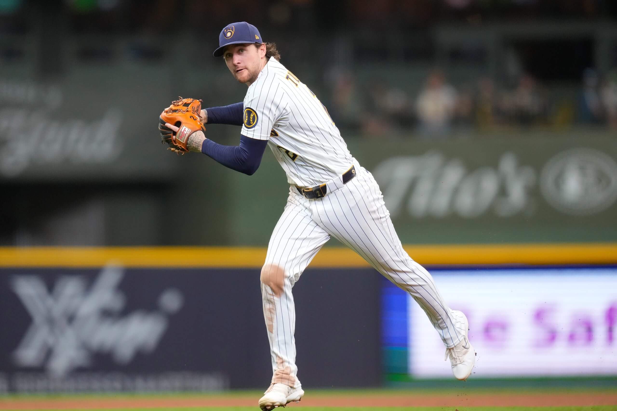 Infielder Brice Turang of the Milwaukee Brewers throws out a batter in the fifth inning against Cincinnati on Sept. 13.