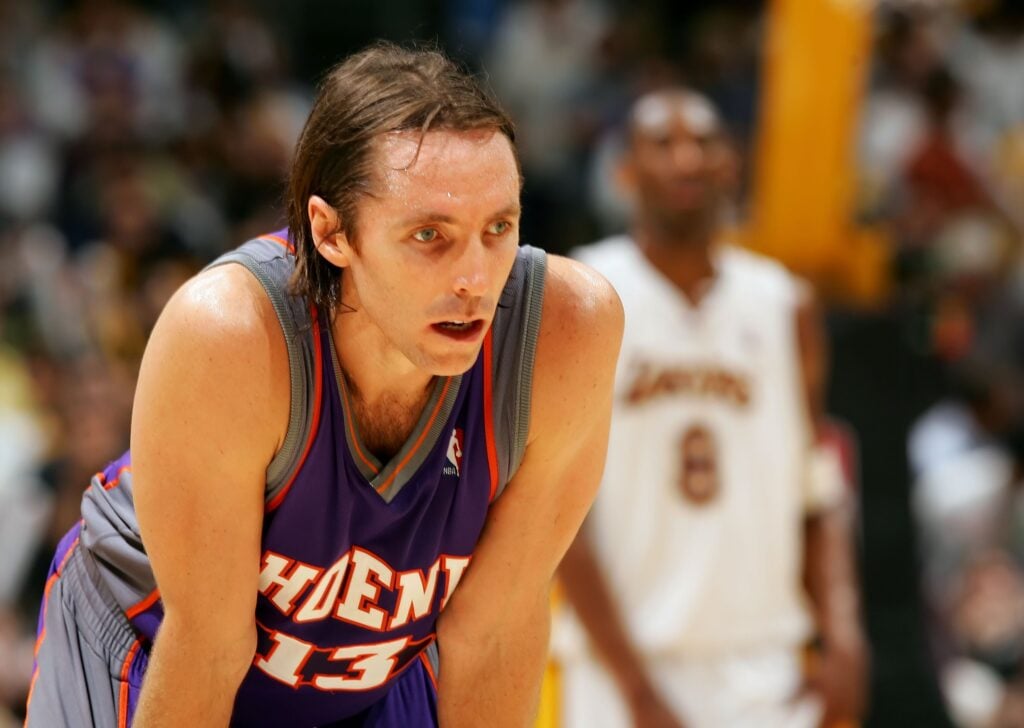 Steve Nash #13 of the Phoenix Suns looks on in front of Kobe Bryant #8 of the Los Angeles Lakers in Game Four of the Western Conference Quarterfinals during the 2006 NBA Playoffs April 30, 2006 at Staples Center.