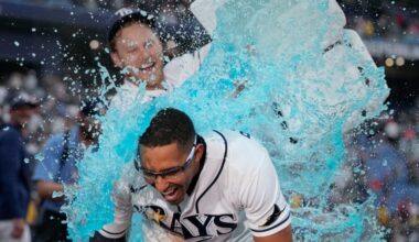 Tampa Bay Rays' Richie Palacios, front, gets doused by Taylor Walls after Palacios hit a walk off single off Boston Red Sox pitcher Garrett Whitlock during the ninth inning of a baseball game Saturday, Sept. 19, 2026, in St. Petersburg, Fla. (AP Photo/Chris O'Meara)