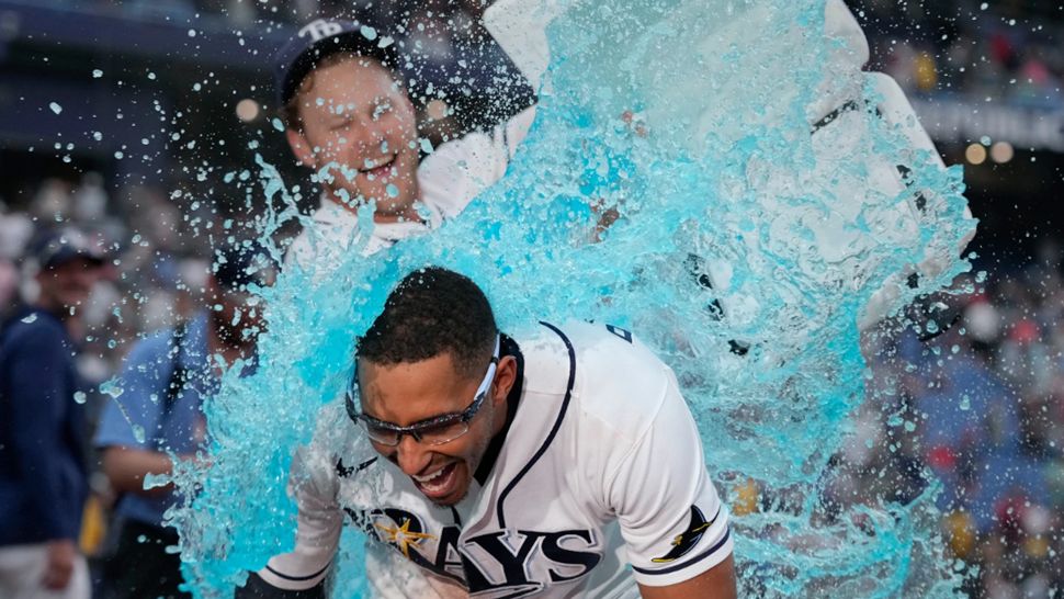 Tampa Bay Rays' Richie Palacios, front, gets doused by Taylor Walls after Palacios hit a walk off single off Boston Red Sox pitcher Garrett Whitlock during the ninth inning of a baseball game Saturday, Sept. 19, 2026, in St. Petersburg, Fla. (AP Photo/Chris O'Meara)