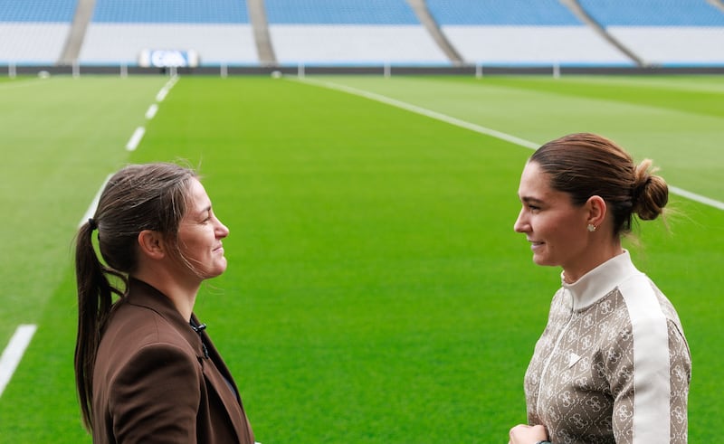 Katie Taylor and Flora Pili face off pitchside at Croke Park. Photograph: Gary Carr/Inpho