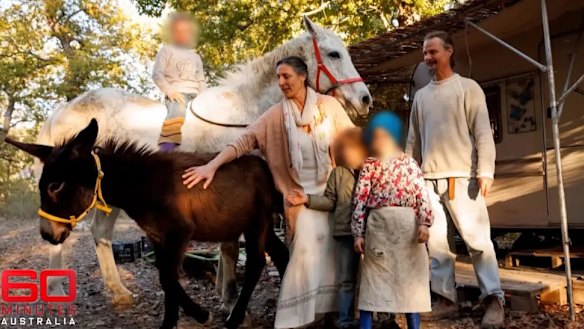 Nathan Trevallion and Catherine Birmingham with their children at their woodland home in Italy.