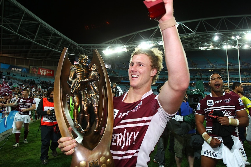 A man celebrates winning a premiership