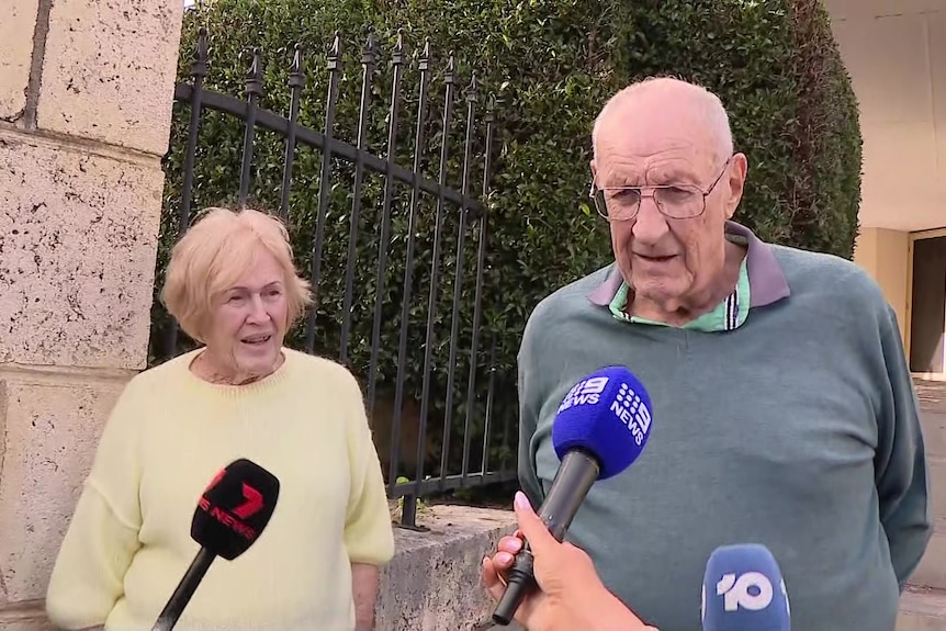 Carol and Barry are interviewed by media on the front steps of their house