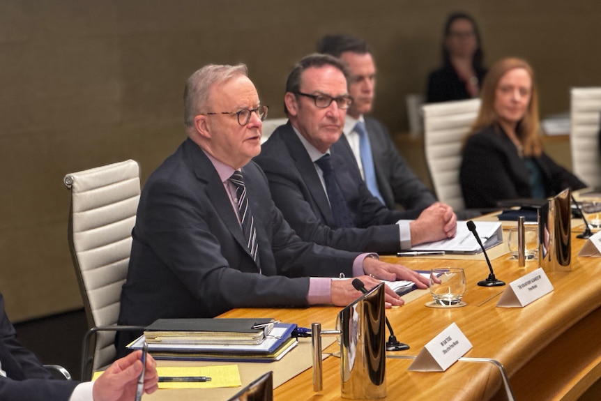 Anthony Albanese sitting at a table with state premiers