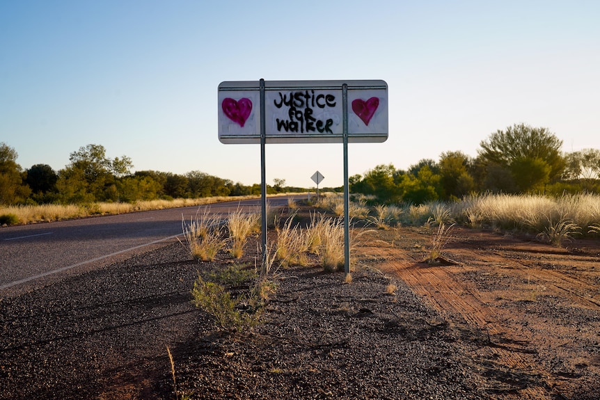 Justice for Walker message spray painted on a remote road sign