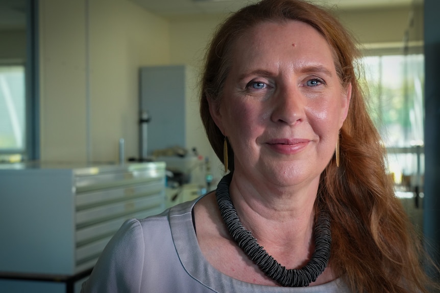 Portrait of woman smiling in a lab room