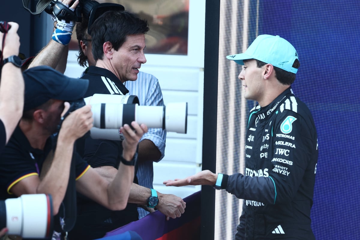 Toto Wolff in conversation with George Russell in the paddock