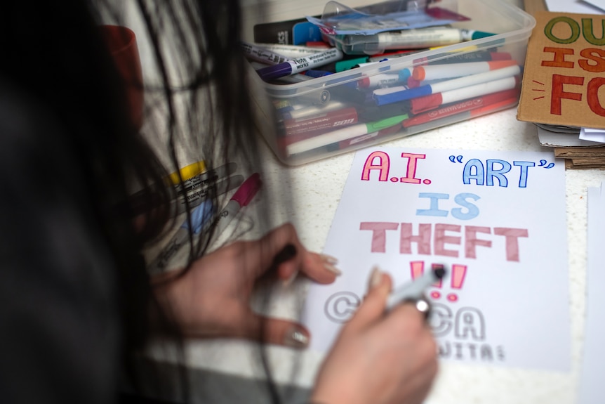 Close-up angle of colourful hand drawn posters protesting AI data centres and AI in general.
