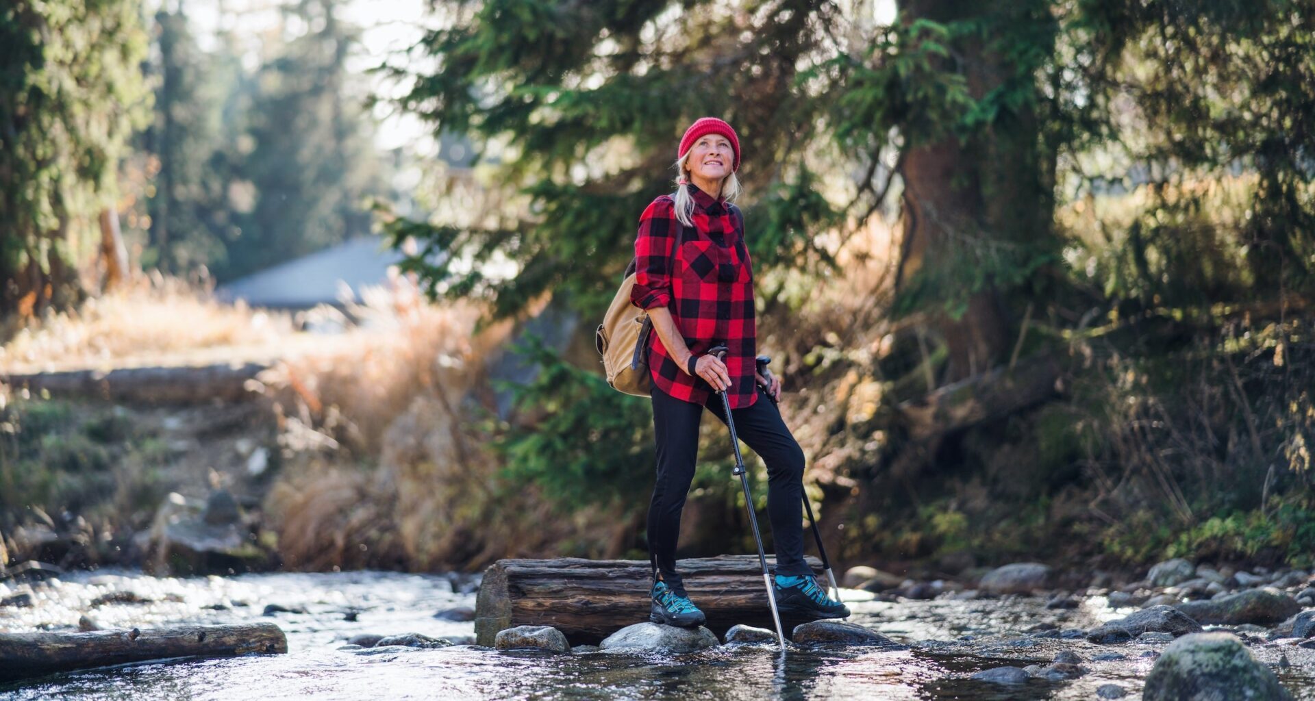 A senior woman walking in woods