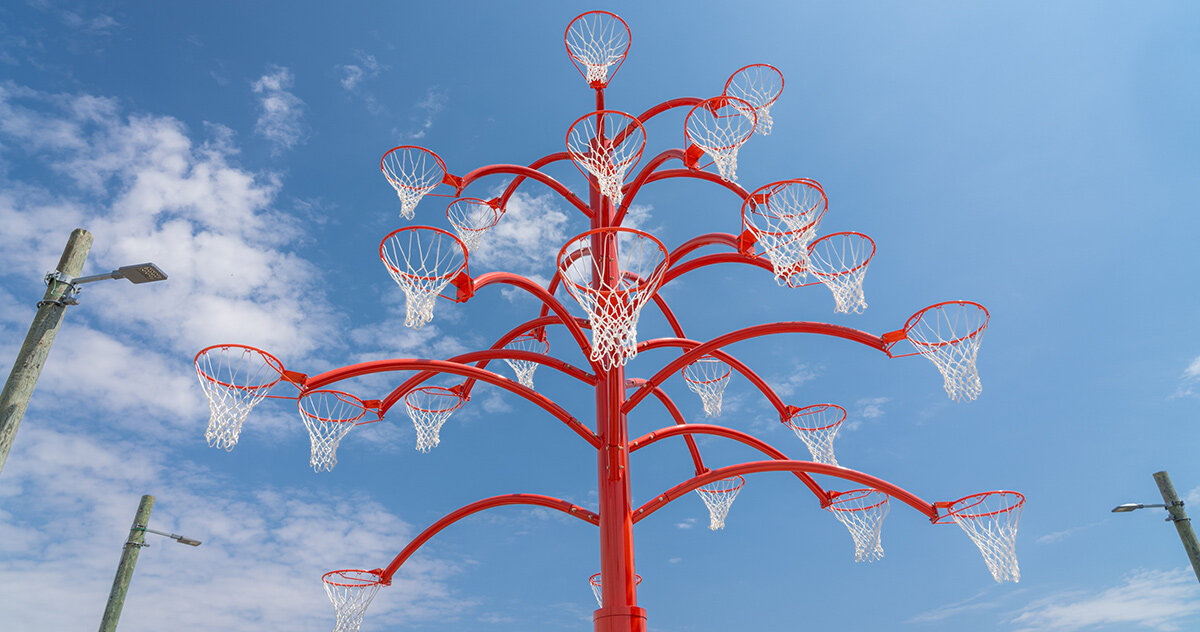 alexandre arrechea grows a playable tree of basketball hoops in toronto