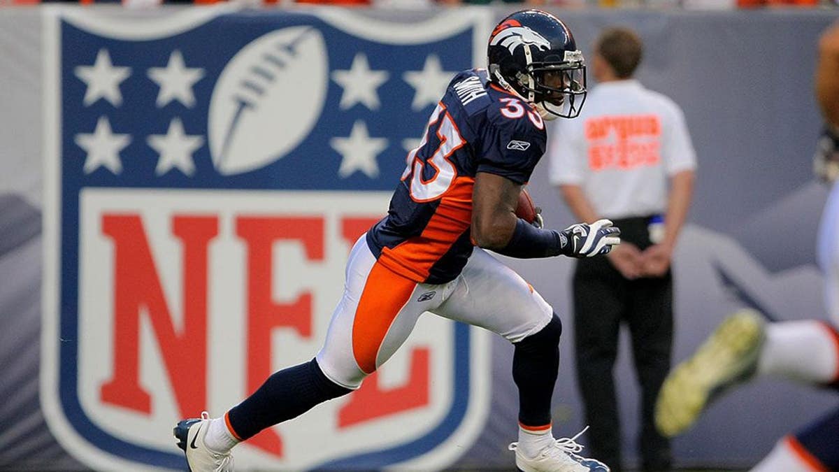 Alphonso Smith #33 returns the opening kickoff during an NFL preseason game.