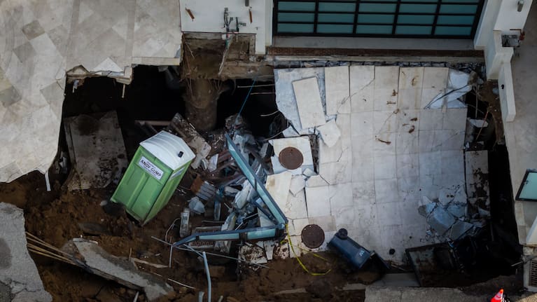 An aerial view of a sinkhole which collapsed the driveway of a coastal mansion owned by actor Nicolas Cage.