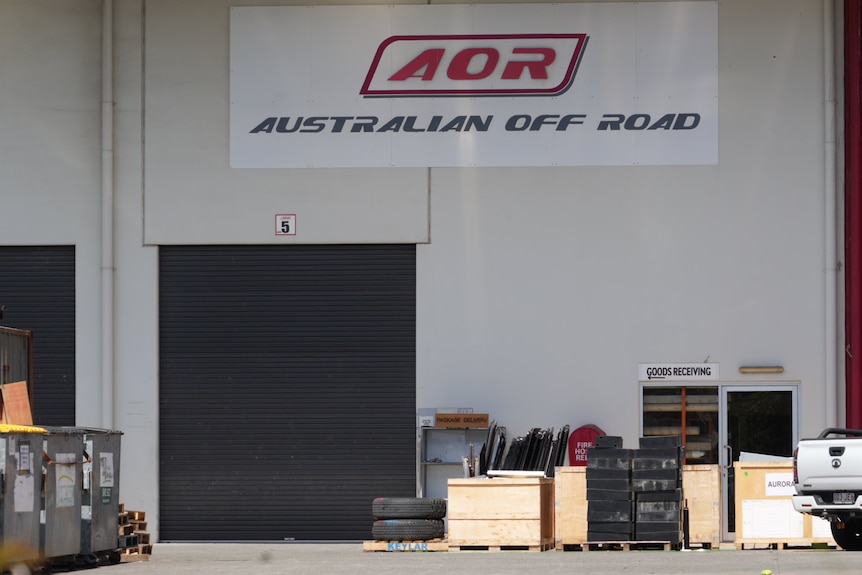 roller door and equipment, sign on wall that says Australian Off Road