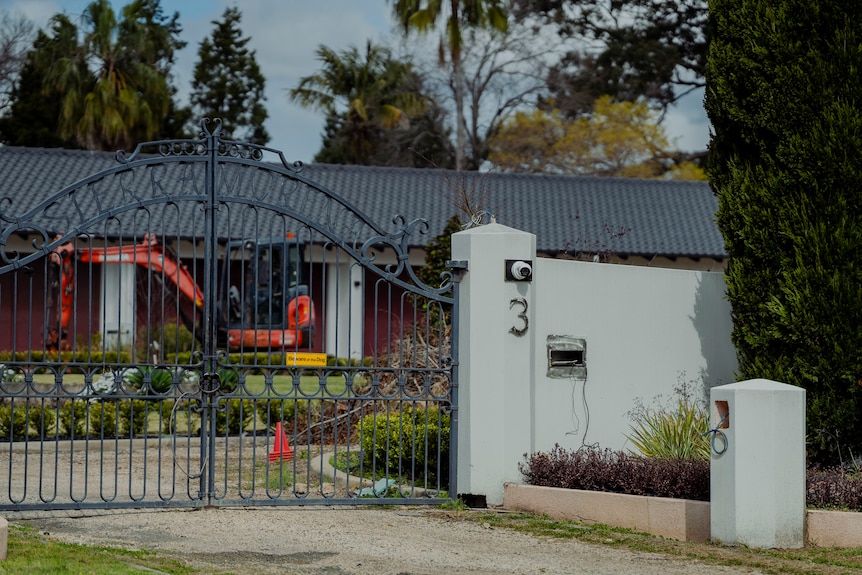 Dural property with a fancy gate, on a sprawling property.