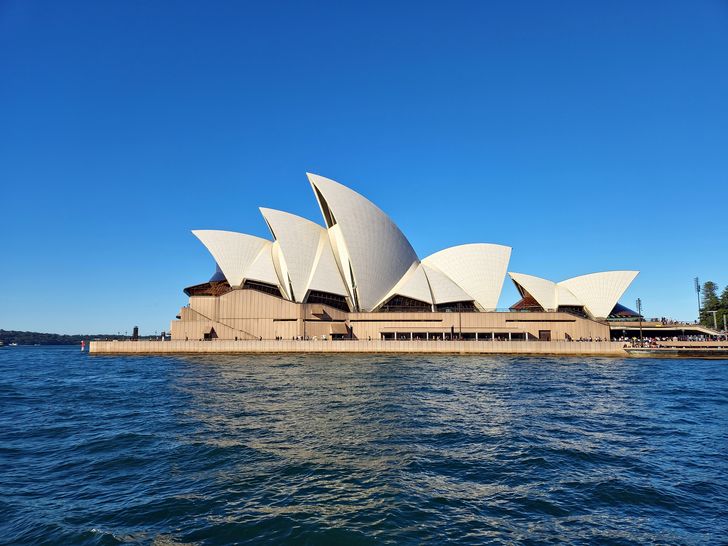 A postcard view of the Sydney Opera House
from the harbour.