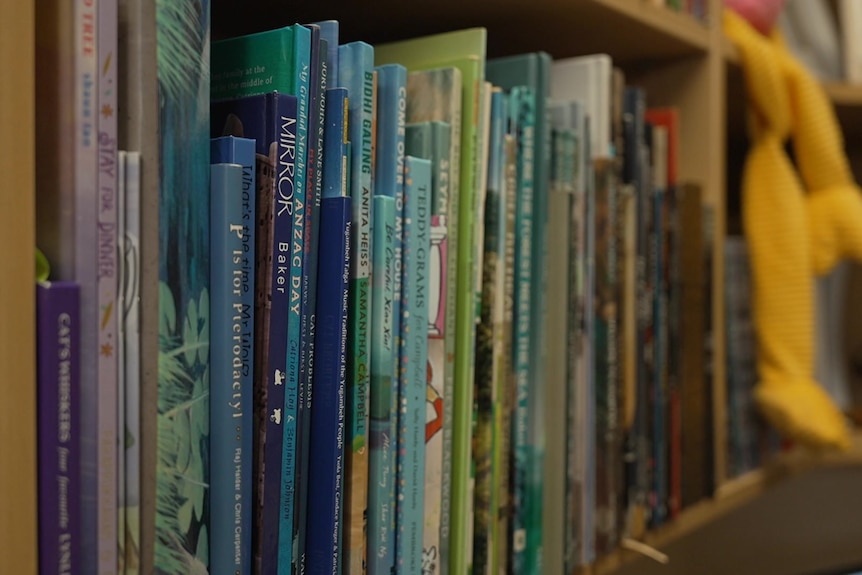 Spines of children's book on a shelf
