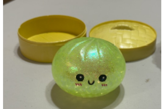 A squishy yellow dumpling toy.