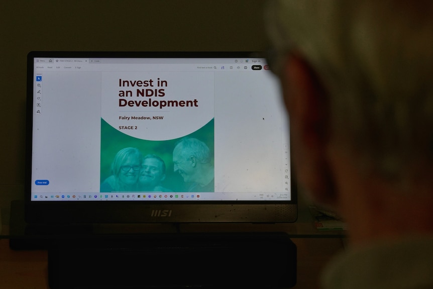 A computer screen shows a broshure reading 'Invest in an NDIS Development'