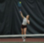 Juneau-Douglas High School: Yadaa.at Kalé senior Aurora Madsen serves during the Region V tennis championships at The Alaska Club in the Mendenhall Valley on Friday, Sept. 25, 2026. Madsen has played four seasons with the Crimson Bears. (Klas Stolpe / Juneau Independent)