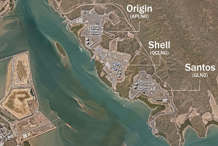 A satellite image of curtis island an the three gas plants next to each other