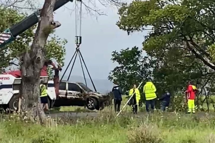 The car is pulled from the water.