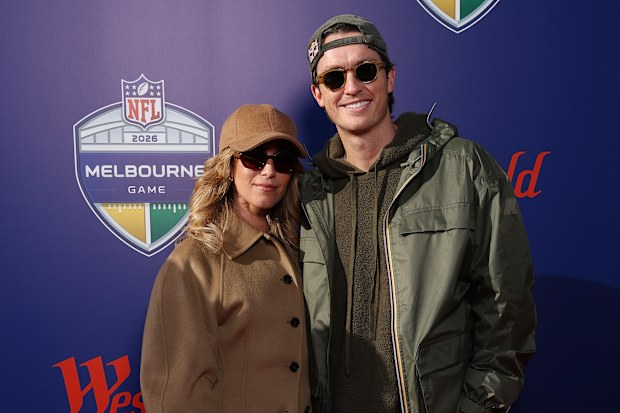 Chloe Stroll and Scotty James arrive at the MCG ahead of the San Francisco 49ers v Los Angeles Rams game.