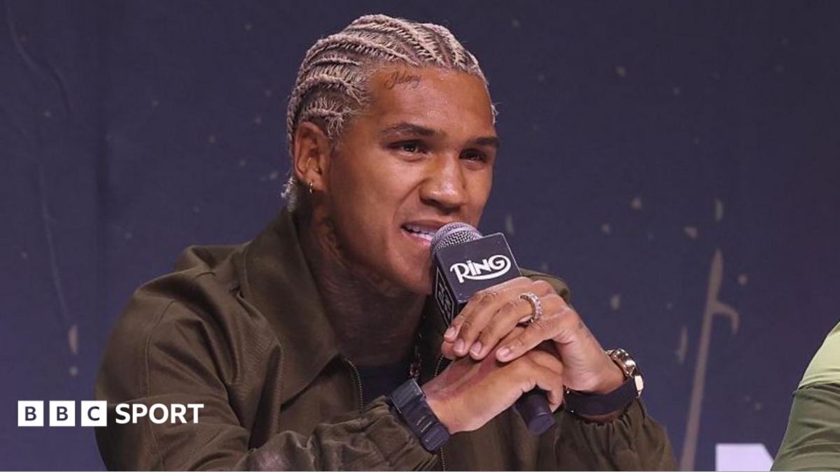 Jai Opetaia speaks into the microphone at a news conference