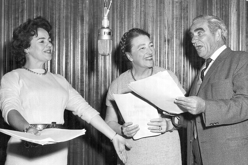 Black and white photo from 1962 showing voice actors recording in studio