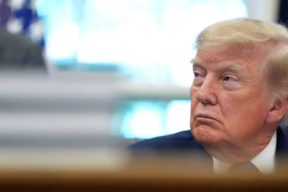 President Donald Trump listens during an event in the Oval Office of the White House, Monday, Sept. 28, 2026, in Washington. (AP Photo/Alex Brandon)