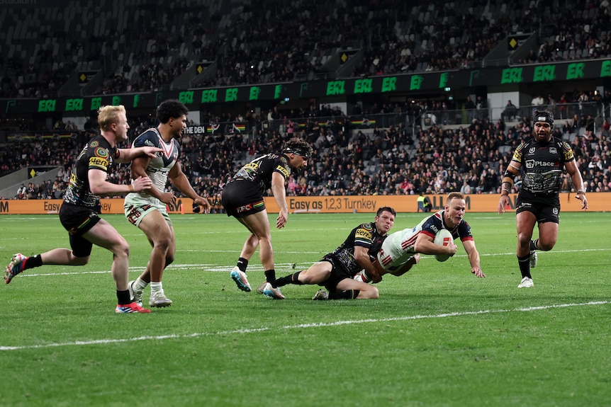 A man scores a try in a rugby league match