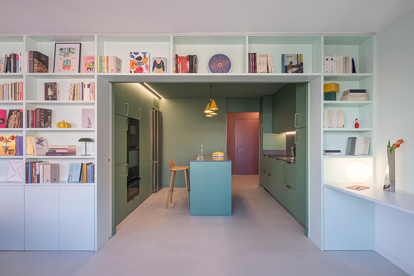 a sequence of colored rooms and a continuous bookcase reshape a madrid apartment - 1