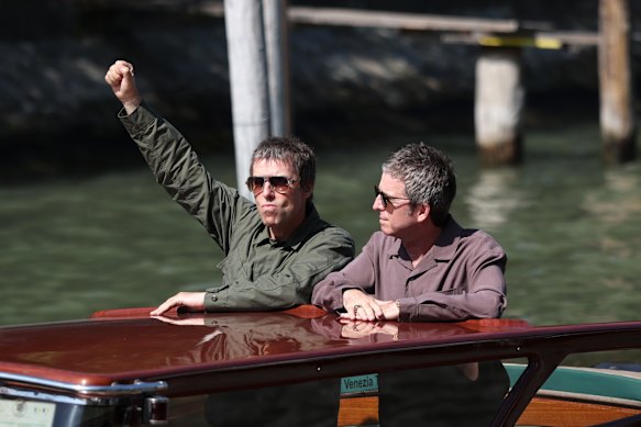 The Gallagher brothers arrive in Venice.