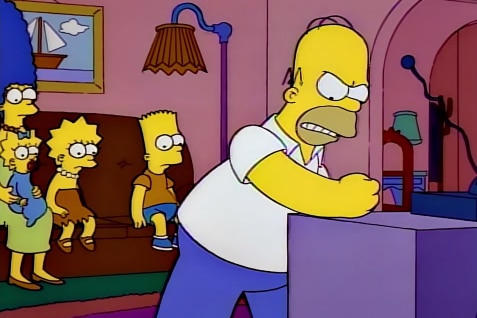 A still image from the Simpsons which shows Homer pounding his TV