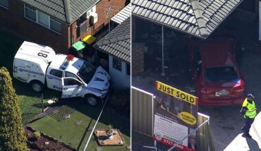 Two fighting for life, critical incident declared after police vehicle and sedan collide before crashing into Bossley Park homes