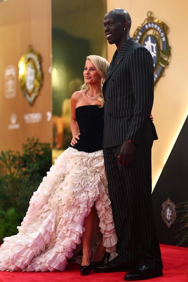 Aliir Aliir of the Power and partner Sabina Wheatley arrive ahead of the 2026 Brownlow Medal at Crown Palladium on September 21, 2026 in Melbourne, Australia.
