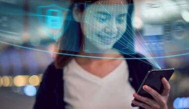 Face identification technology concept, Asian woman holding smartphone and scanning face ID recognition system.