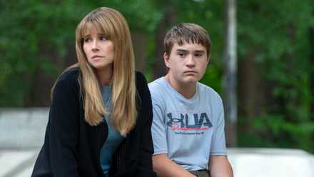 Linda Cardellini as Carol with Arlan Ruf as her son Richard sitting side by side in DTF St. Louis