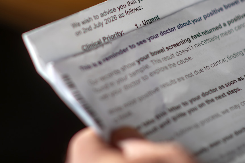 A close up hands holding a letter explaining endoscopy categories
