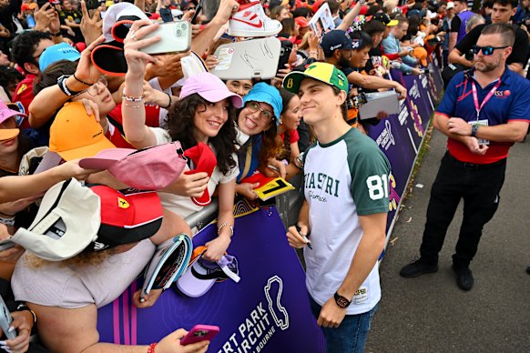 Australian F1 driver Oscar Piastri greets fans at Albert Park. 
