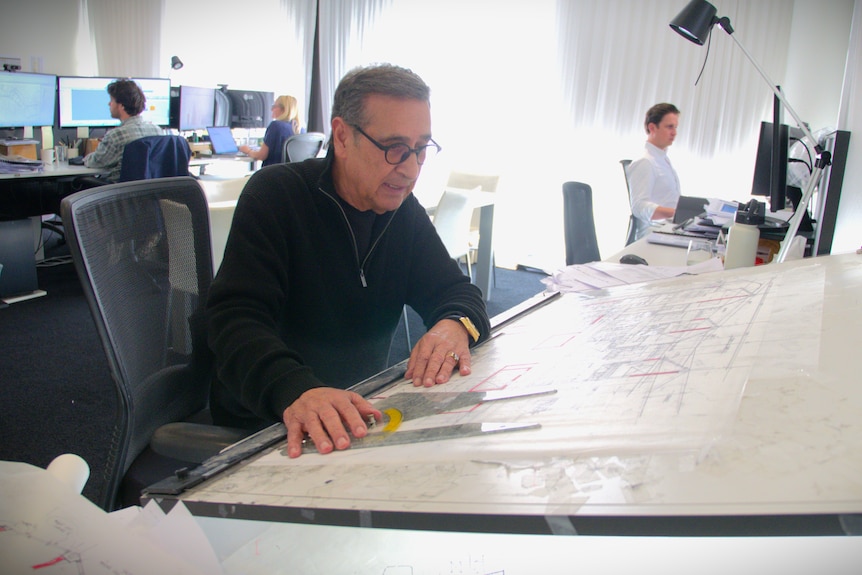 Property developer Soheil Abedian working on plans.