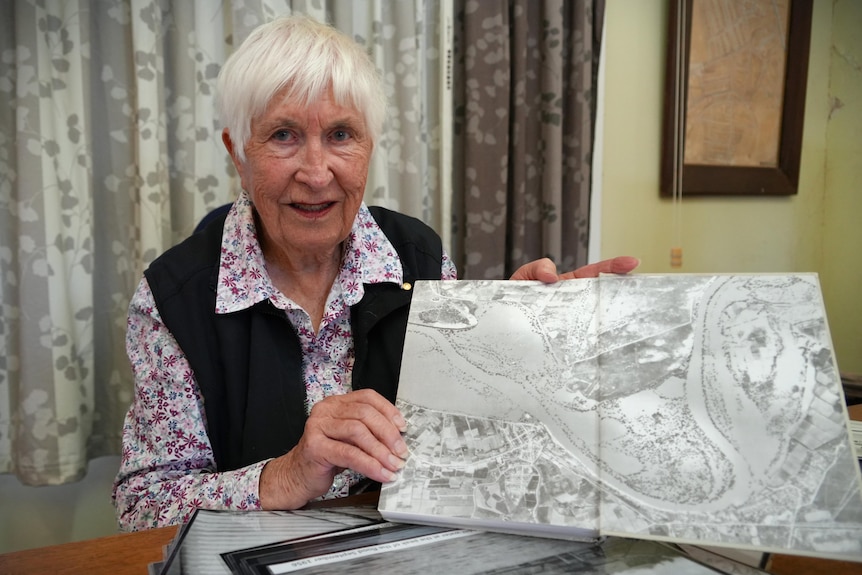a woman holds a photo
