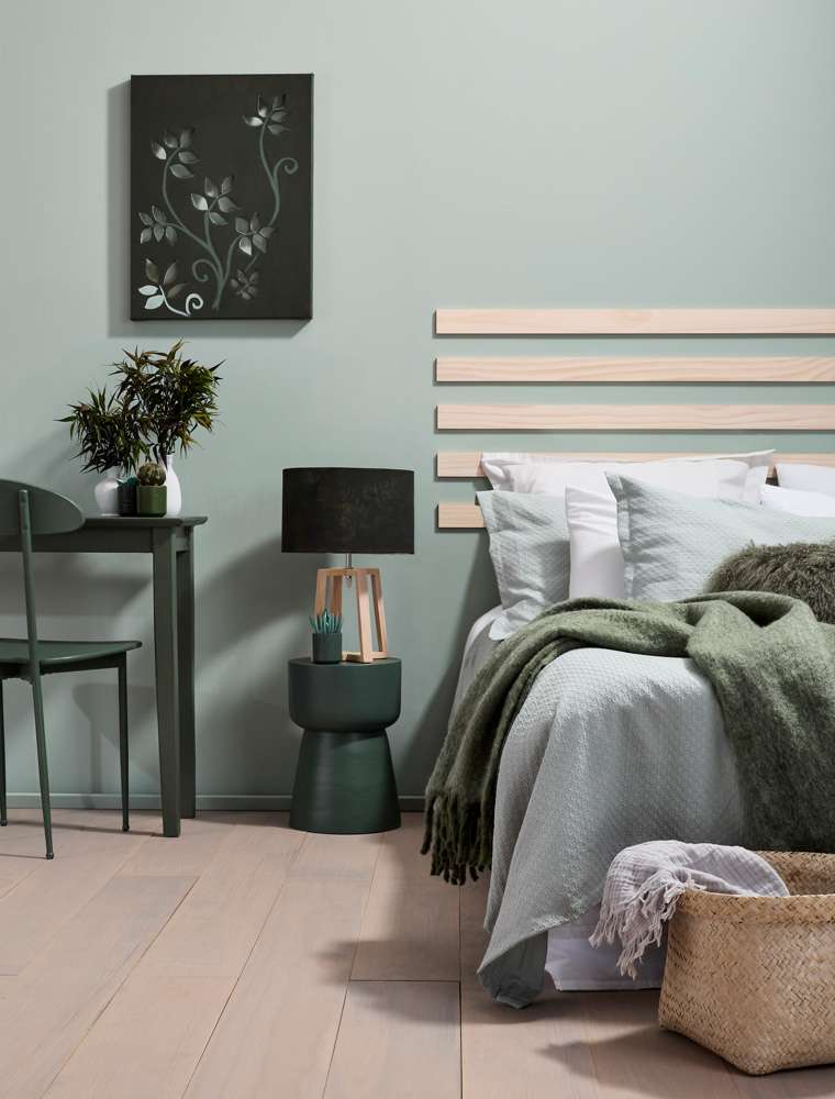 A contrast pattern and depth of colour bring rich warmth to this room that still feels inspired by the coast. Project by Annick Larkin. Mural Hannah Tapner. Photo / Bryce Carleton
