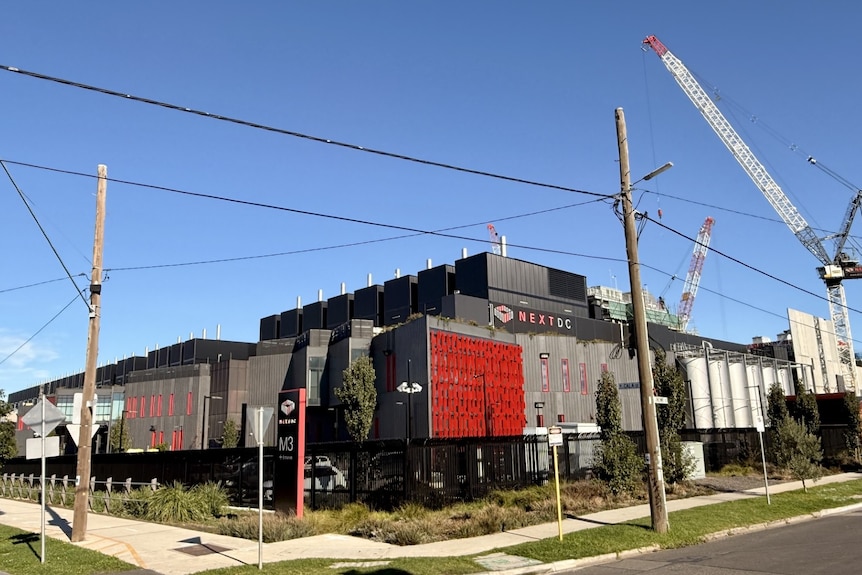 Industrial building with a crane in the background