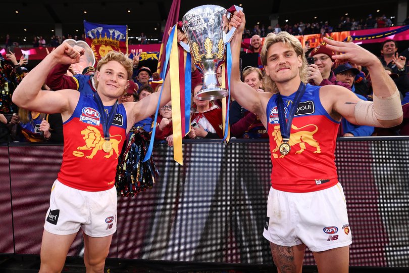 Levi Ashcroft and Will Ashcroft of the Lions celebrate with the Premiership Cup.