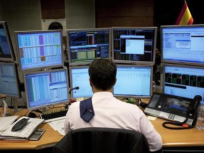 A trader looks at a screen during a bond auction.